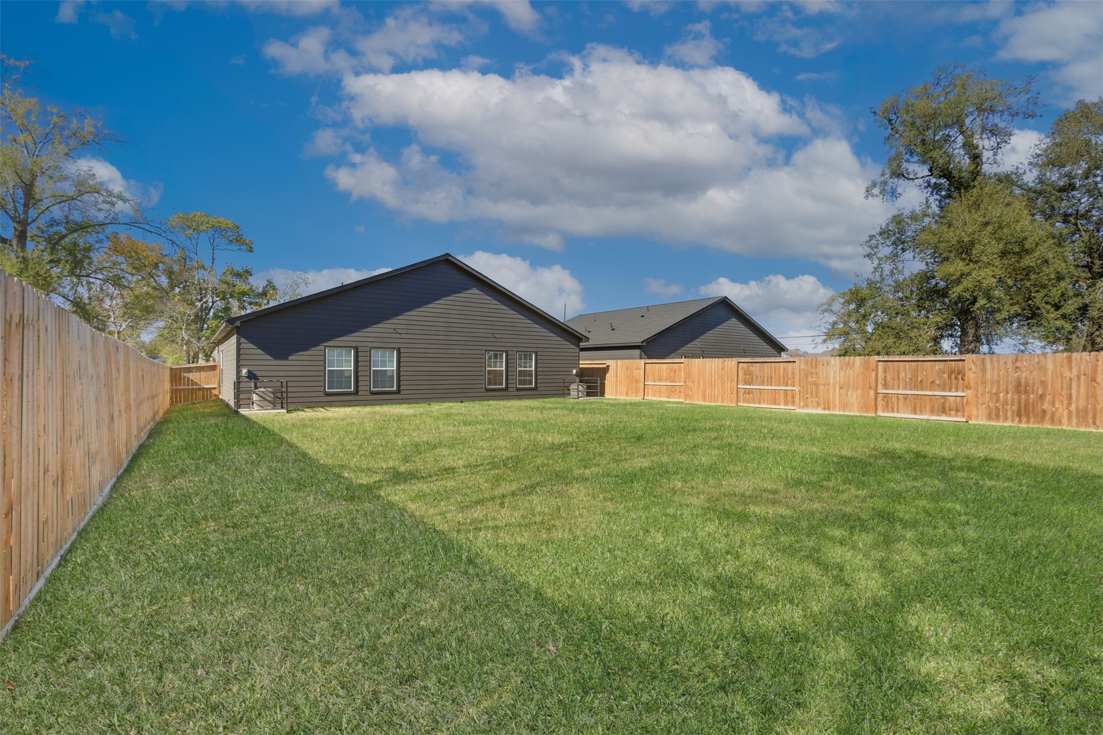 9412 Crofton Street, Unit B Houston, TX 77016 - Photo 20 of 20 a front view of a house with garden