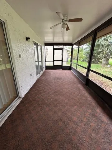 a view of an empty room with a large window