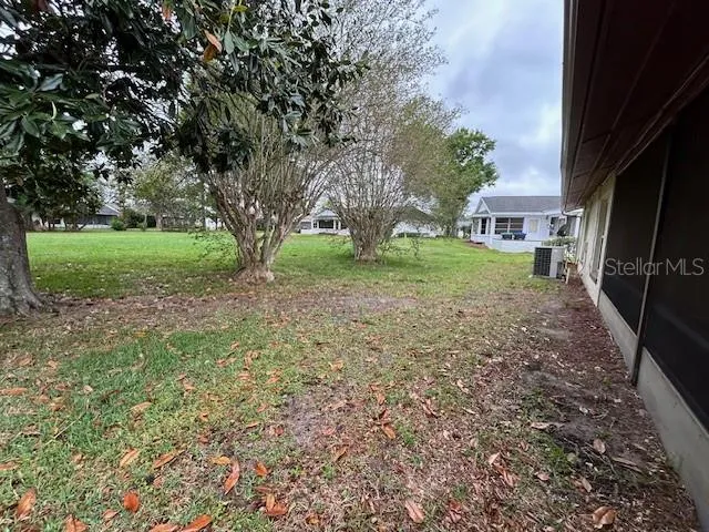a view of backyard with green space