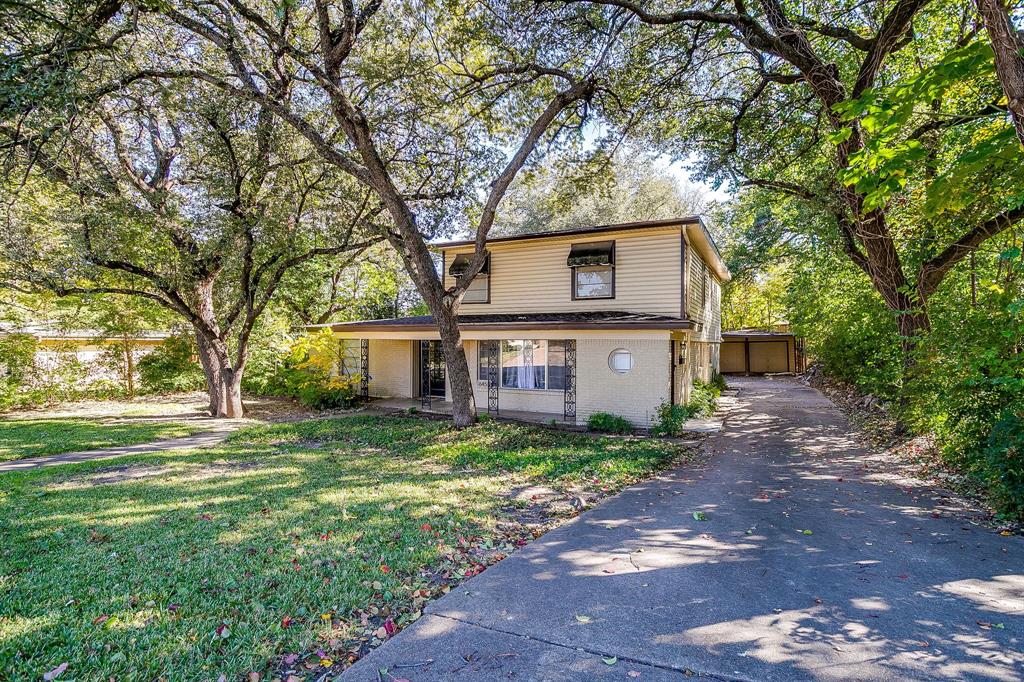 6455 Waverly Way Fort Worth, TX 76116 - Photo 2 of 16 a house that has a tree in front of the house