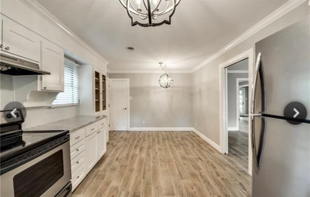 6455 Waverly Way Fort Worth, TX 76116 - Photo 5 of 16 a kitchen with a sink and wooden floor
