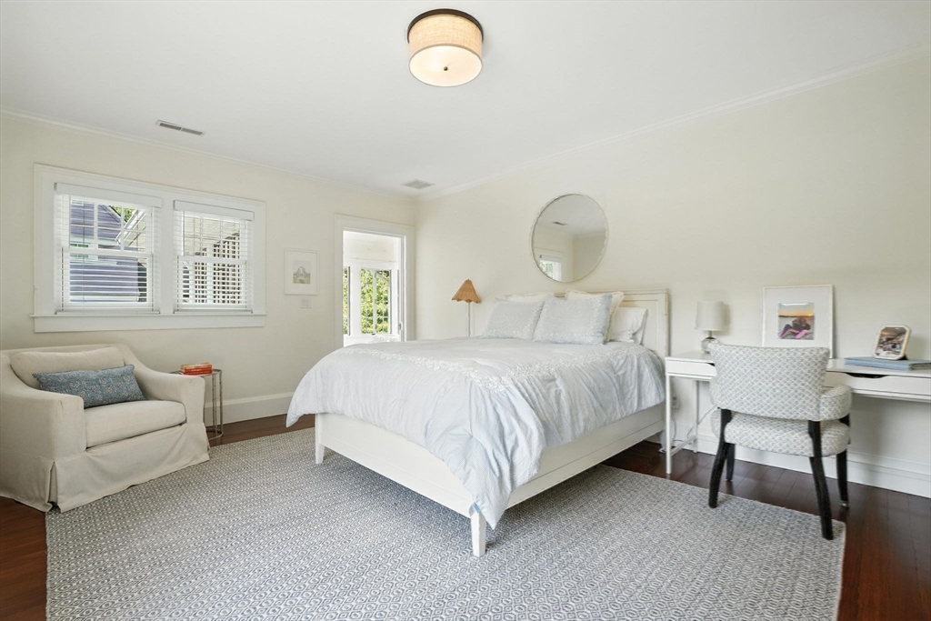 15 Winthrop Road Lexington, MA 02421 - Photo 31 of 39 a bedroom with a bed and a chandelier