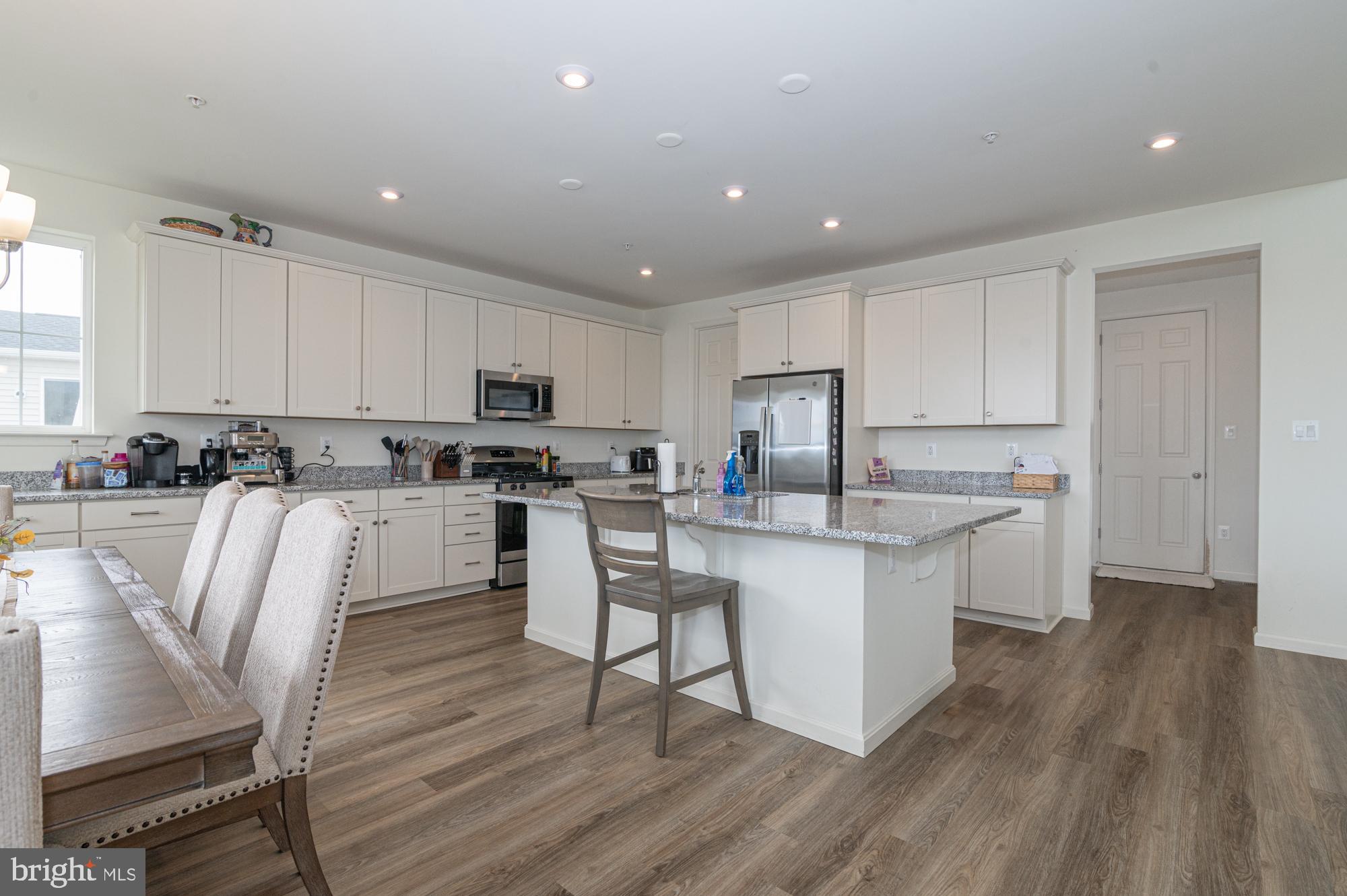 411 Karn Place Brunswick, MD 21716 - Photo 4 of 10 a kitchen with granite countertop a sink a counter top space stainless steel appliances and cabinets