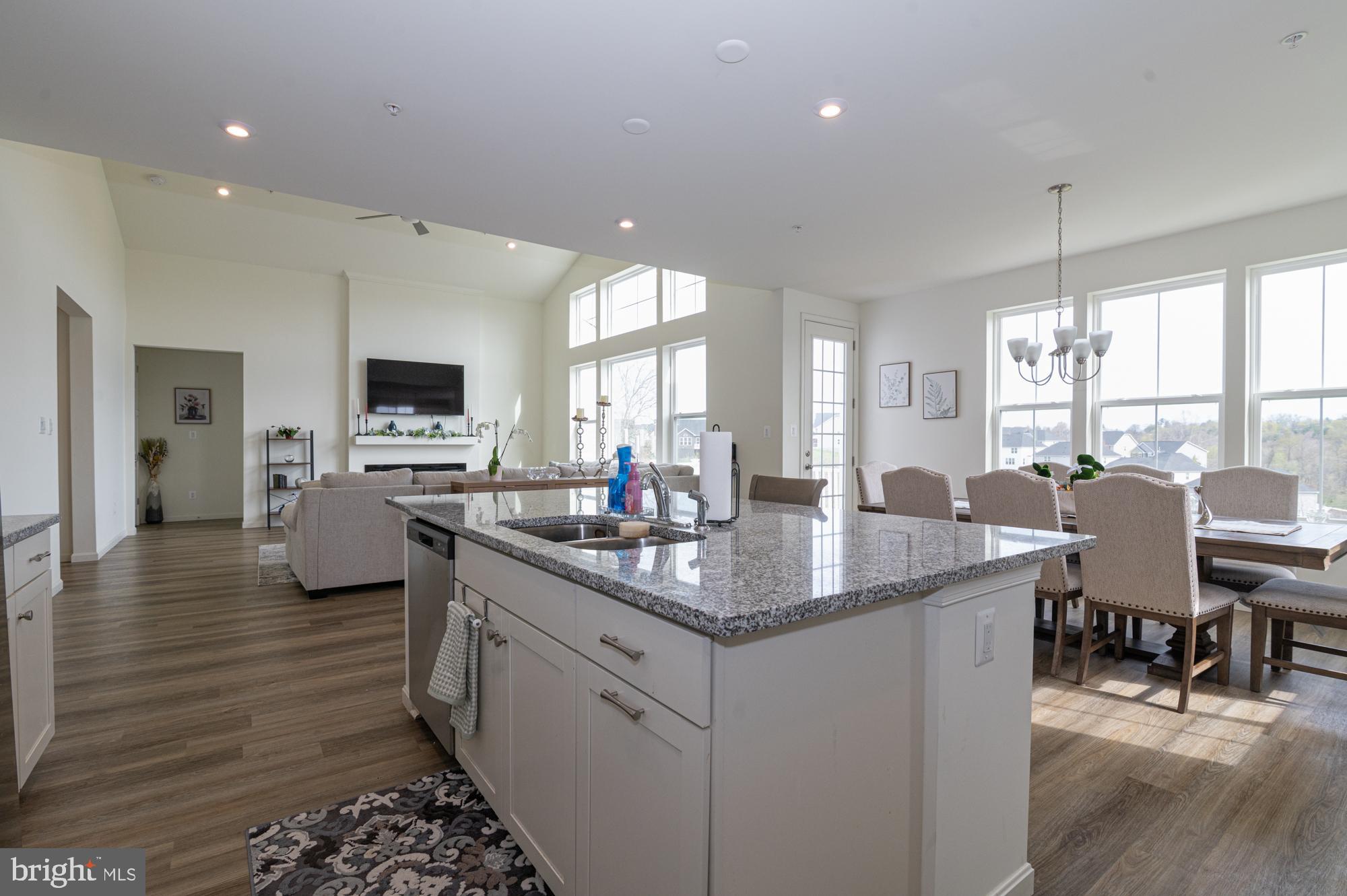 411 Karn Place Brunswick, MD 21716 - Photo 5 of 10 a kitchen with sink stove and dining table