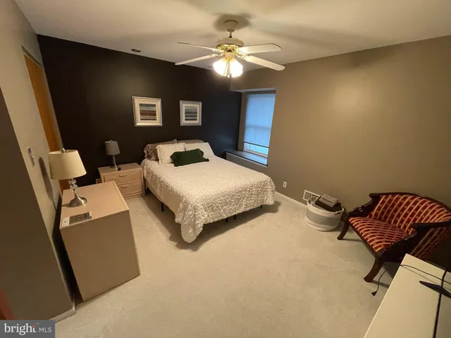 a bathroom with a sink toilet and mirror