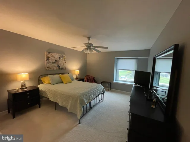 a balcony with wooden floor and stairs