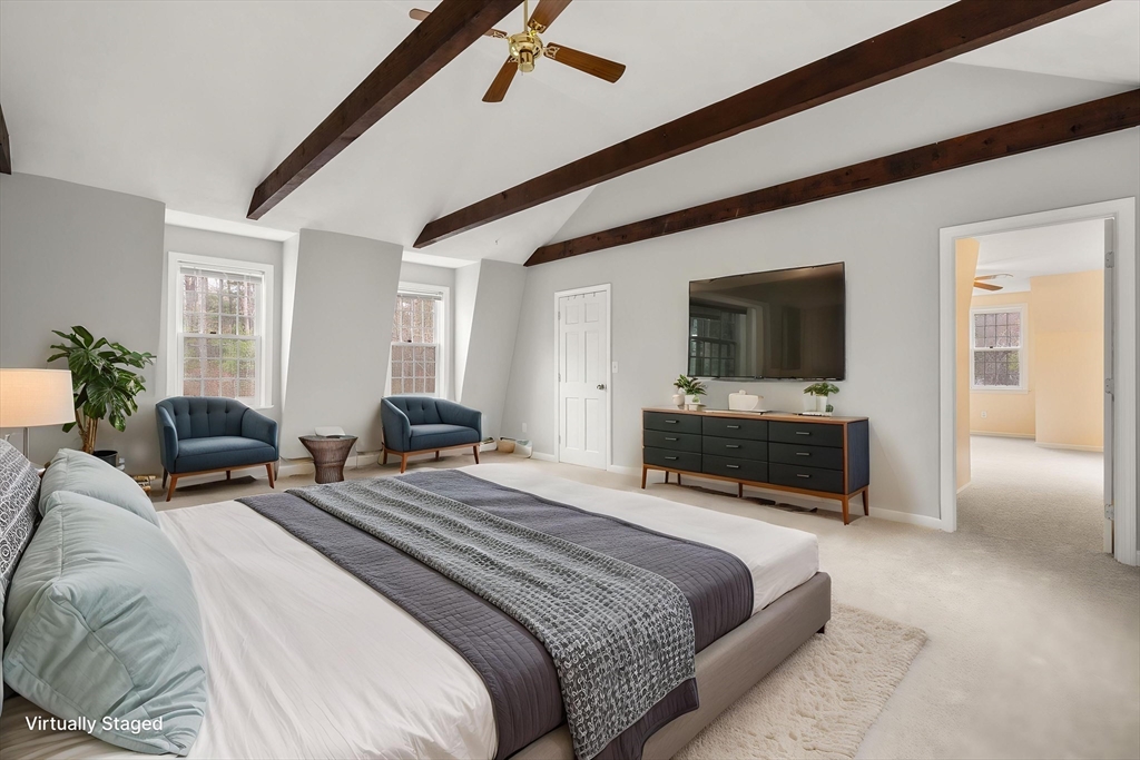 202 Newtown Road Acton, MA 01720 - Photo 25 of 40 a bedroom with a bed and a television