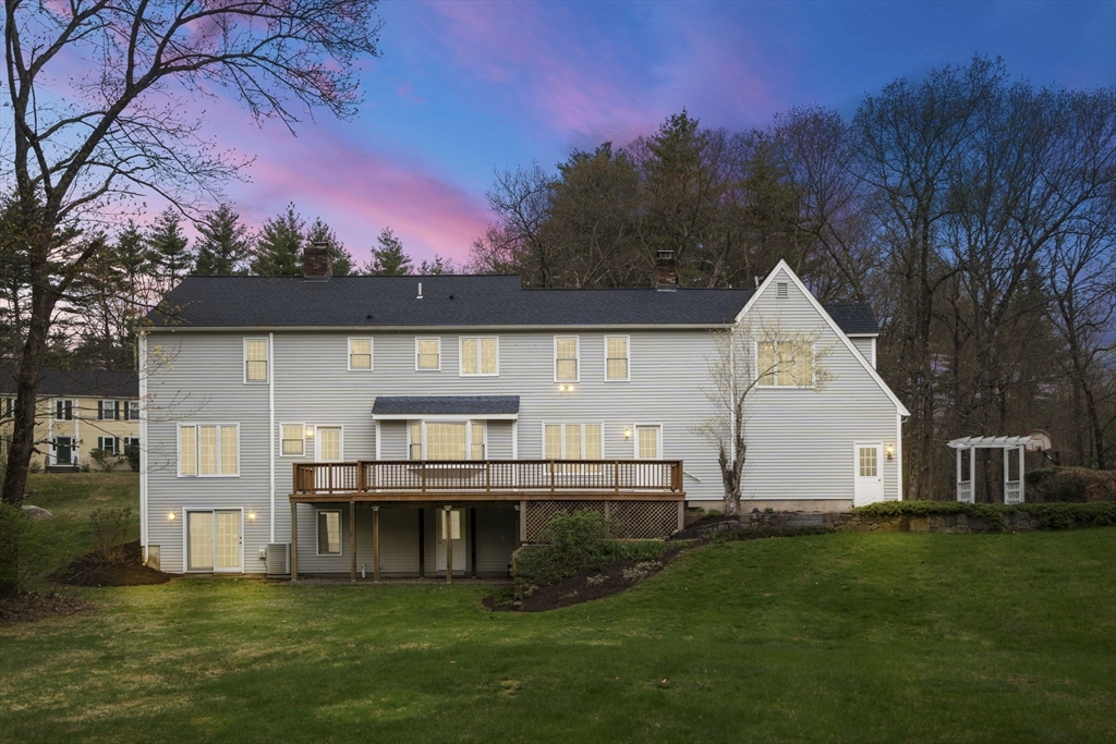 202 Newtown Road Acton, MA 01720 - Photo 33 of 40 a view of a house with backyard and garden