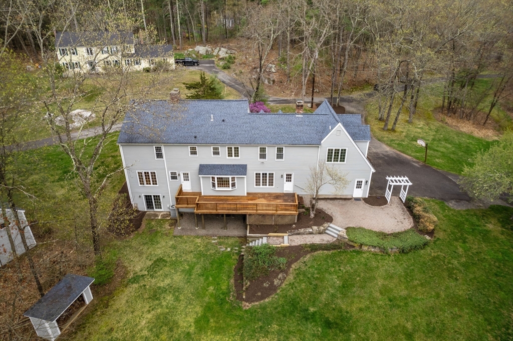 202 Newtown Road Acton, MA 01720 - Photo 34 of 40 a aerial view of a house with pool and a yard