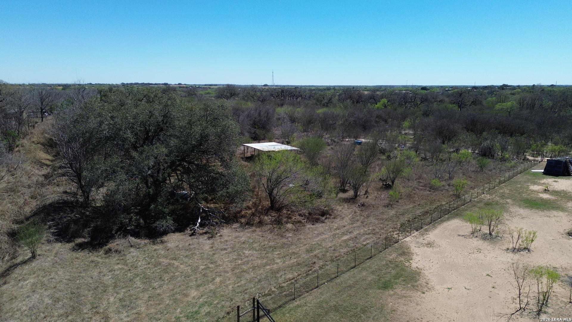 14364 Greenwood Road Atascosa, TX 78002 - Photo 10 of 10 a view of a dry yard with trees