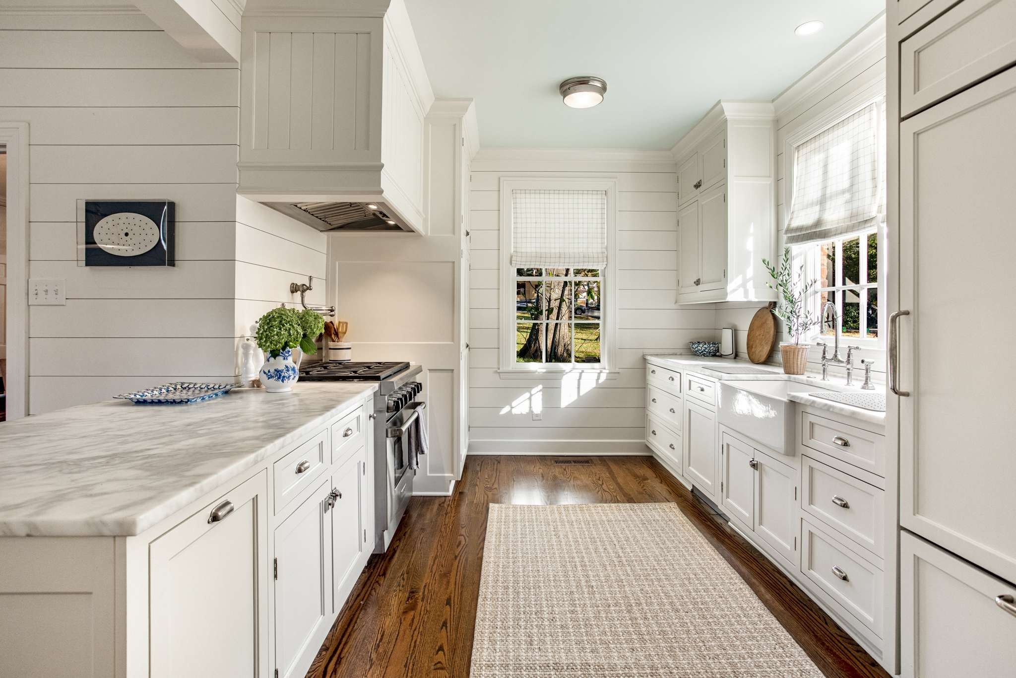 4313 Estes Road Nashville, TN 37215 - Photo 12 of 25 a kitchen with sink stove and cabinets