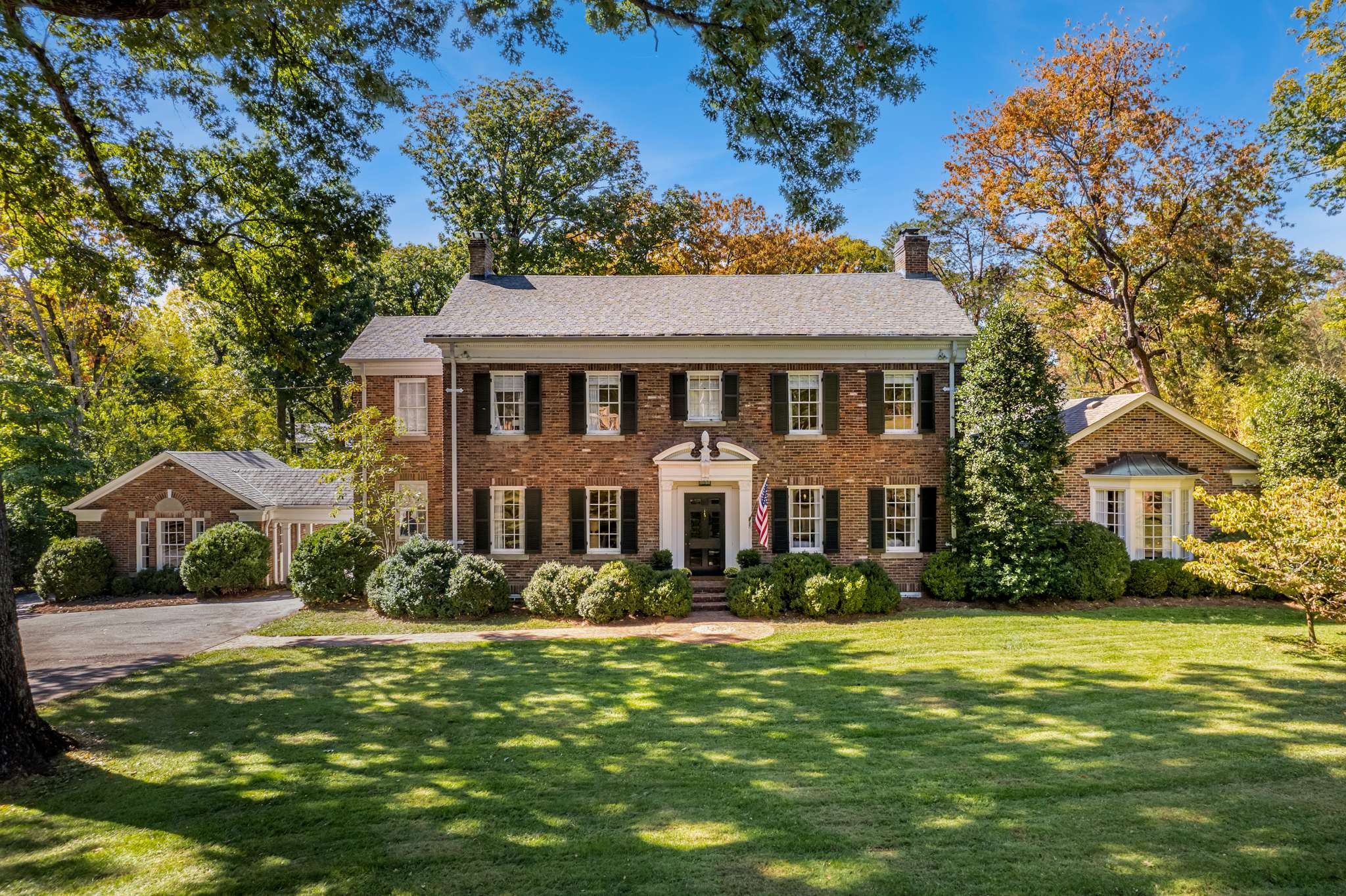 4313 Estes Road Nashville, TN 37215 - Photo 2 of 25 a front view of a house with a garden