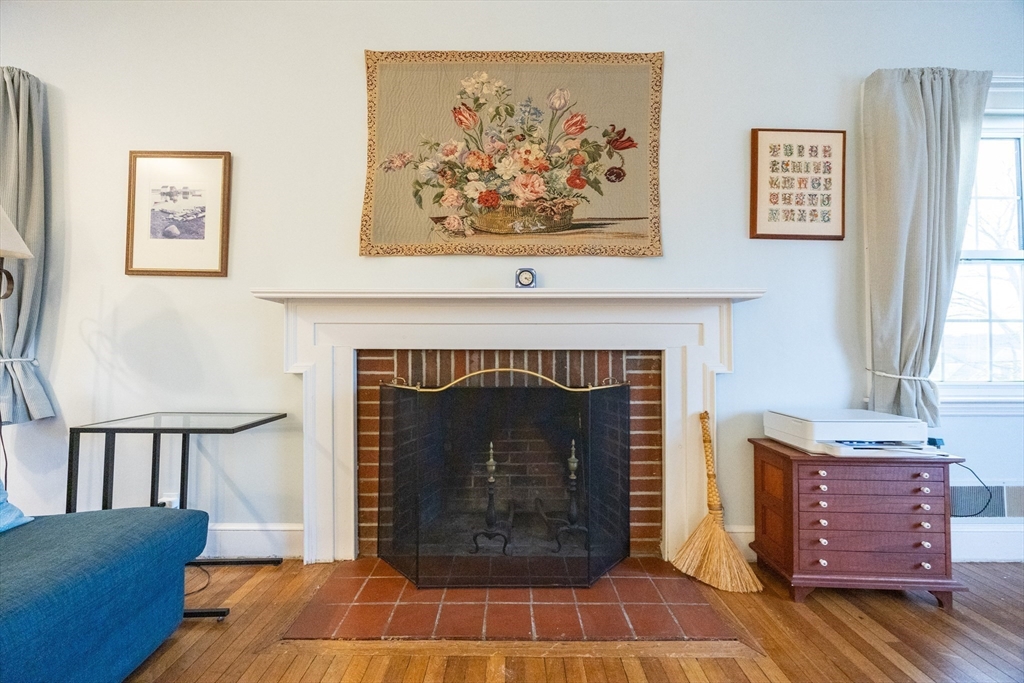 51 Barnstable Street Swampscott, MA 01907 - Photo 11 of 39 a living room with furniture a flat screen tv and a fireplace