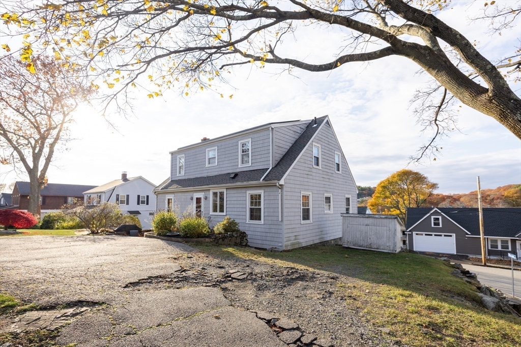 51 Barnstable Street Swampscott, MA 01907 - Photo 26 of 39 a view of a large house with a big yard and large tree