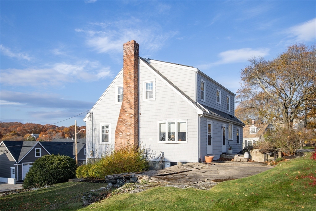 51 Barnstable Street Swampscott, MA 01907 - Photo 31 of 39 a view of a house with a yard and plants