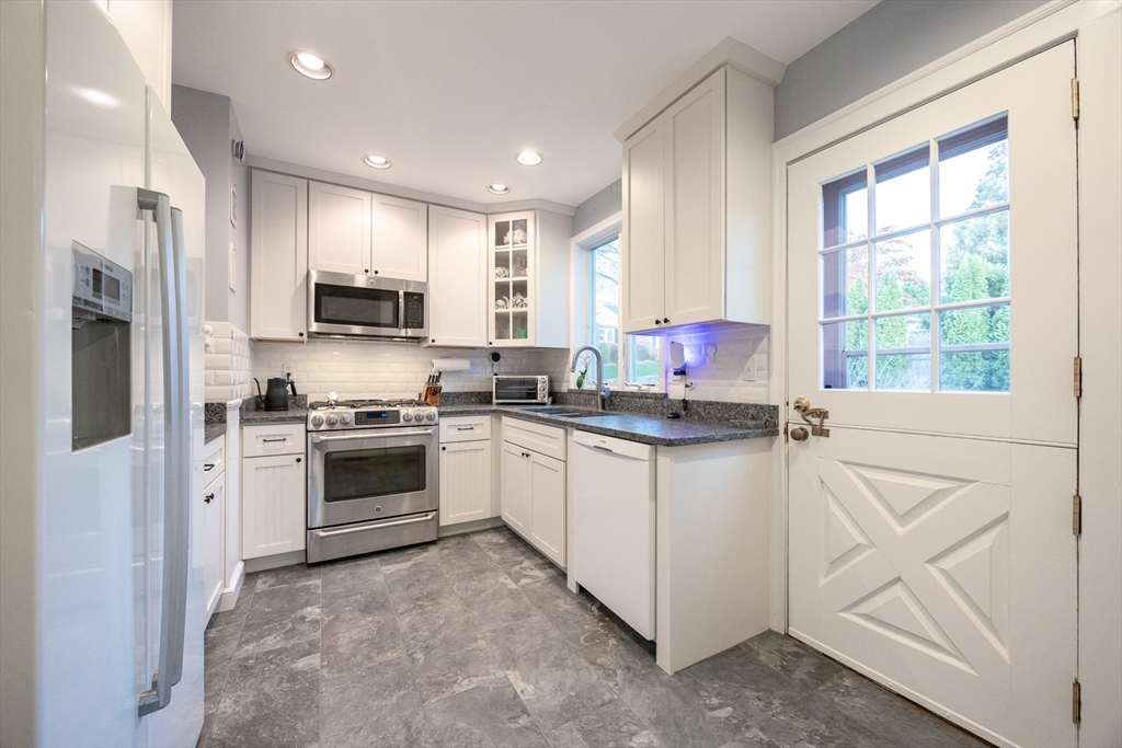 51 Barnstable Street Swampscott, MA 01907 - Photo 4 of 39 a kitchen with stainless steel appliances granite countertop a stove a sink and a refrigerator