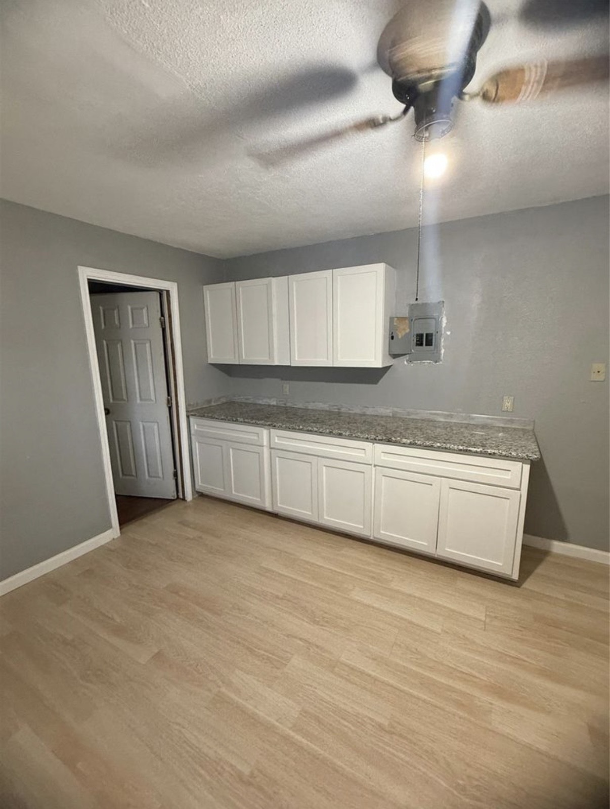 8412 Peekskill Lane Houston, TX 77075 - Photo 13 of 46 a view of an empty room with kitchen and window
