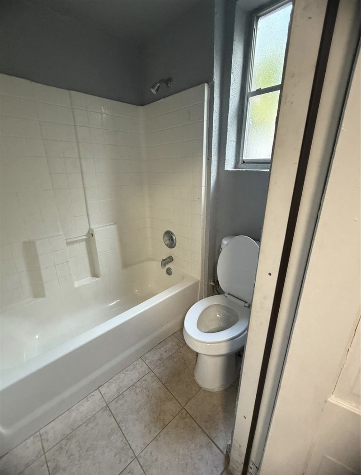 8412 Peekskill Lane Houston, TX 77075 - Photo 20 of 46 a white toilet sitting next to a bath tub