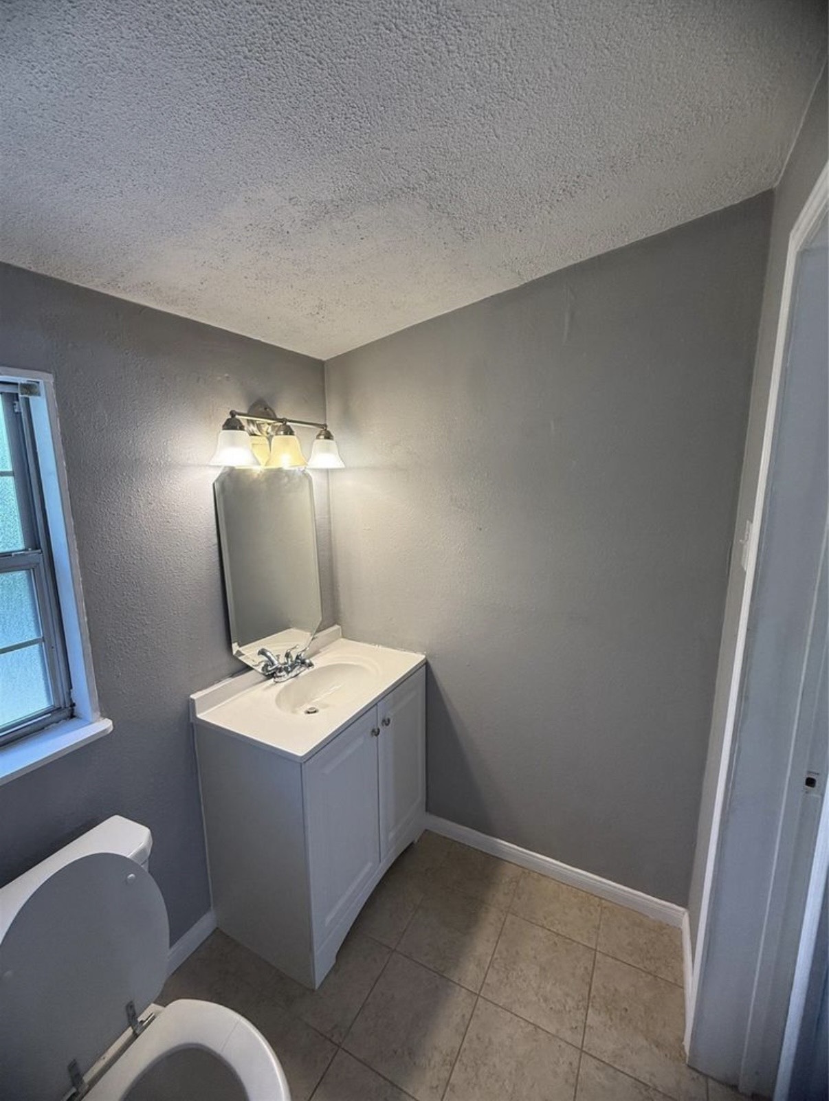 8412 Peekskill Lane Houston, TX 77075 - Photo 31 of 46 a bathroom with a sink toilet and mirror