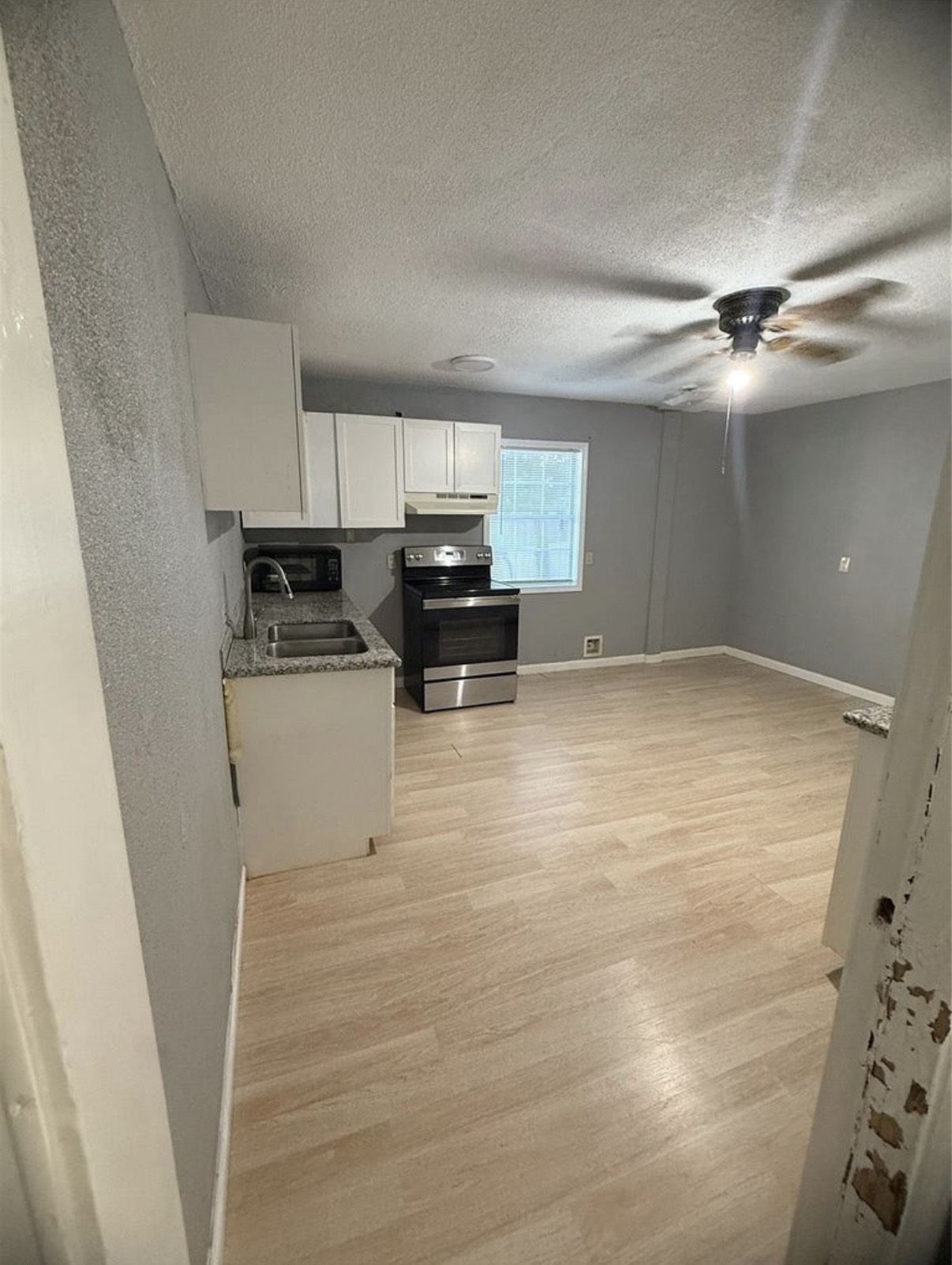 8412 Peekskill Lane Houston, TX 77075 - Photo 10 of 46 a view of kitchen with microwave and cabinets