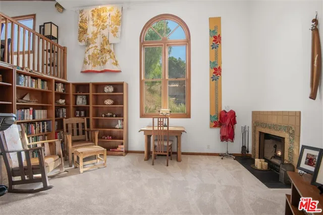 a view of a livingroom with furniture and windows