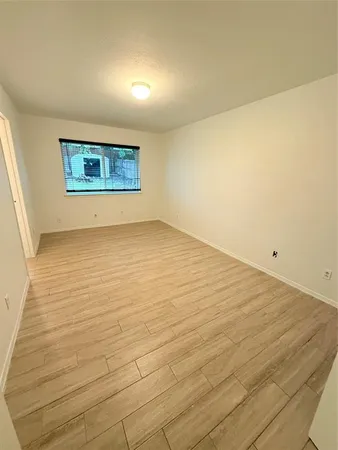 an empty room with a wooden floor