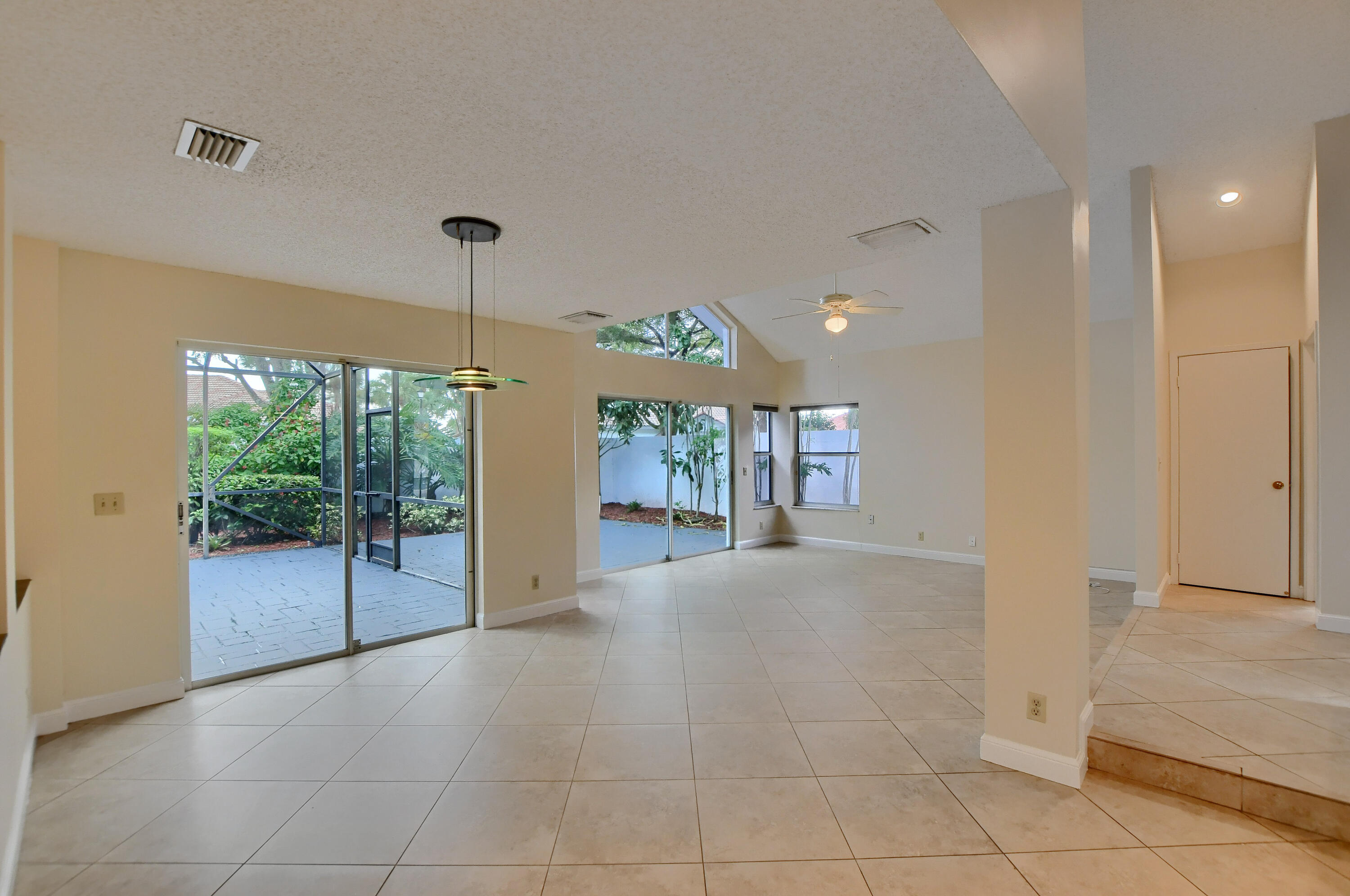 2252 Northwest 53rd Street Boca Raton, FL 33496 - Photo 11 of 41 a view of an entryway with floor to ceiling window and an entryway