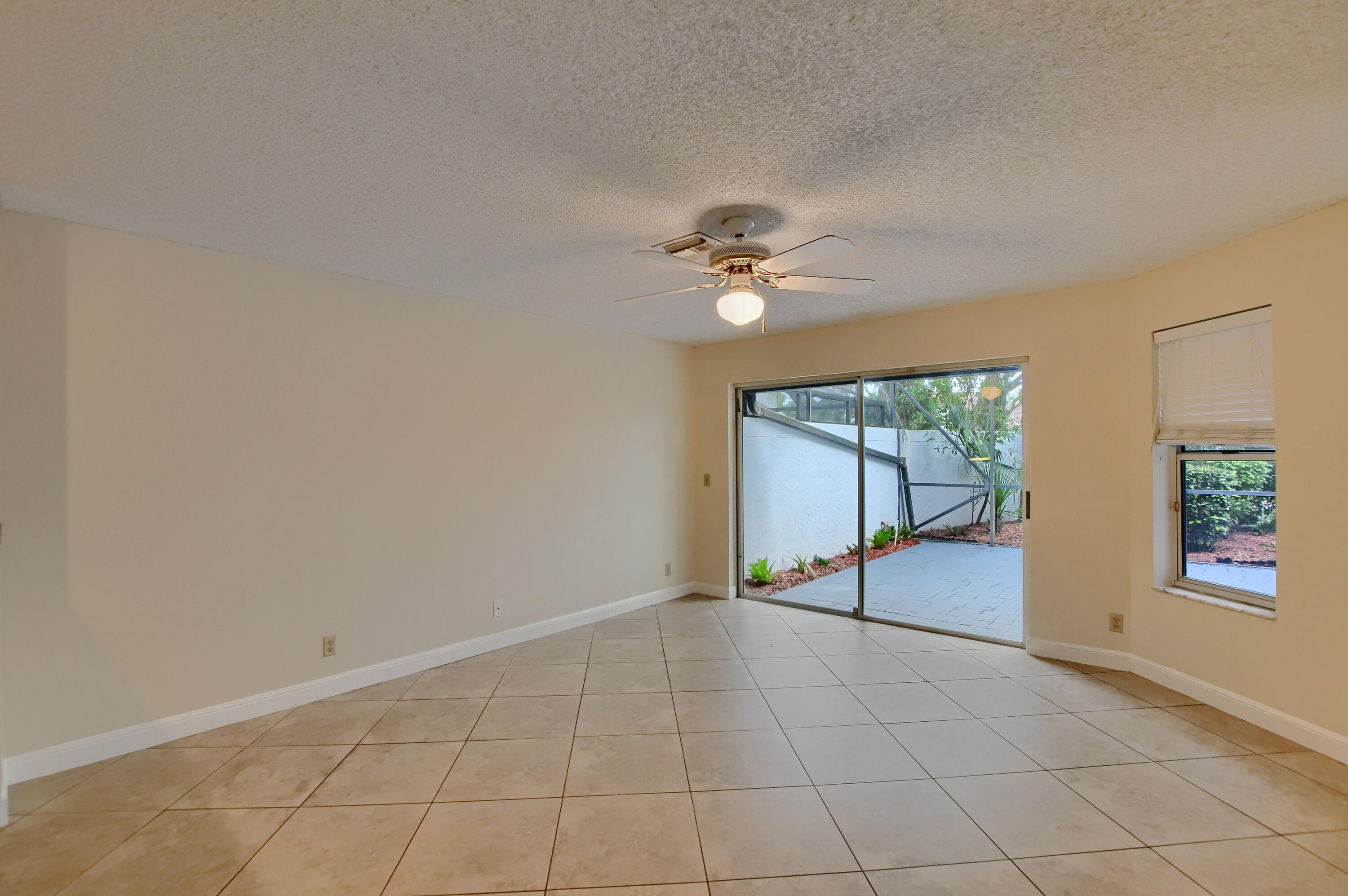 2252 Northwest 53rd Street Boca Raton, FL 33496 - Photo 12 of 41 a view of an empty room with a window