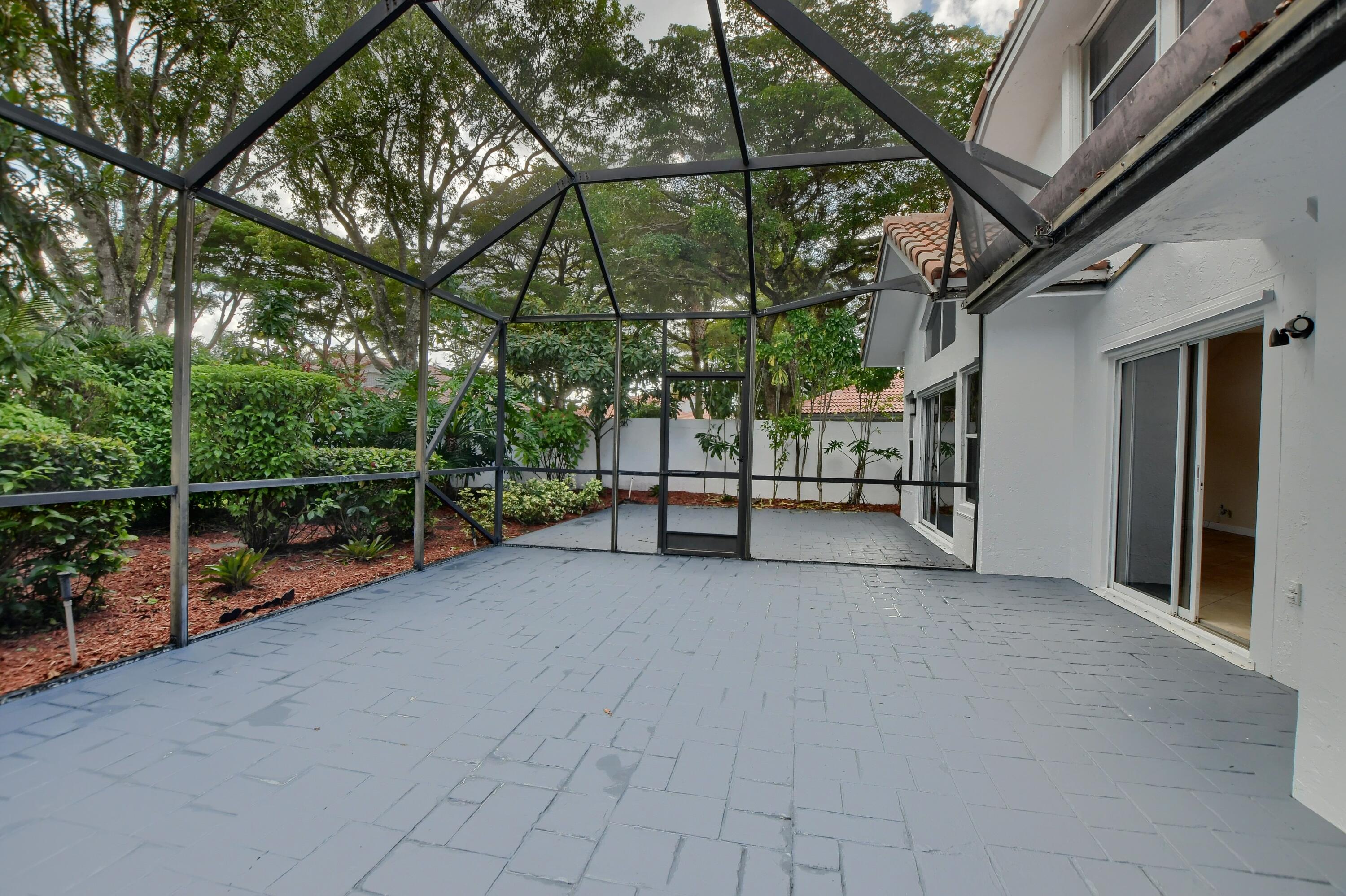 2252 Northwest 53rd Street Boca Raton, FL 33496 - Photo 22 of 41 a view of a house with a street