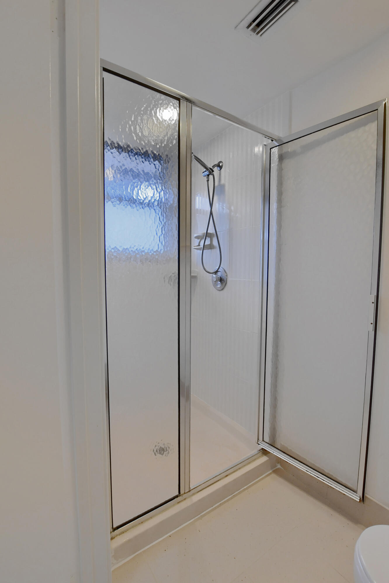 2252 Northwest 53rd Street Boca Raton, FL 33496 - Photo 28 of 41 a bathroom with a glass shower door and a glass door