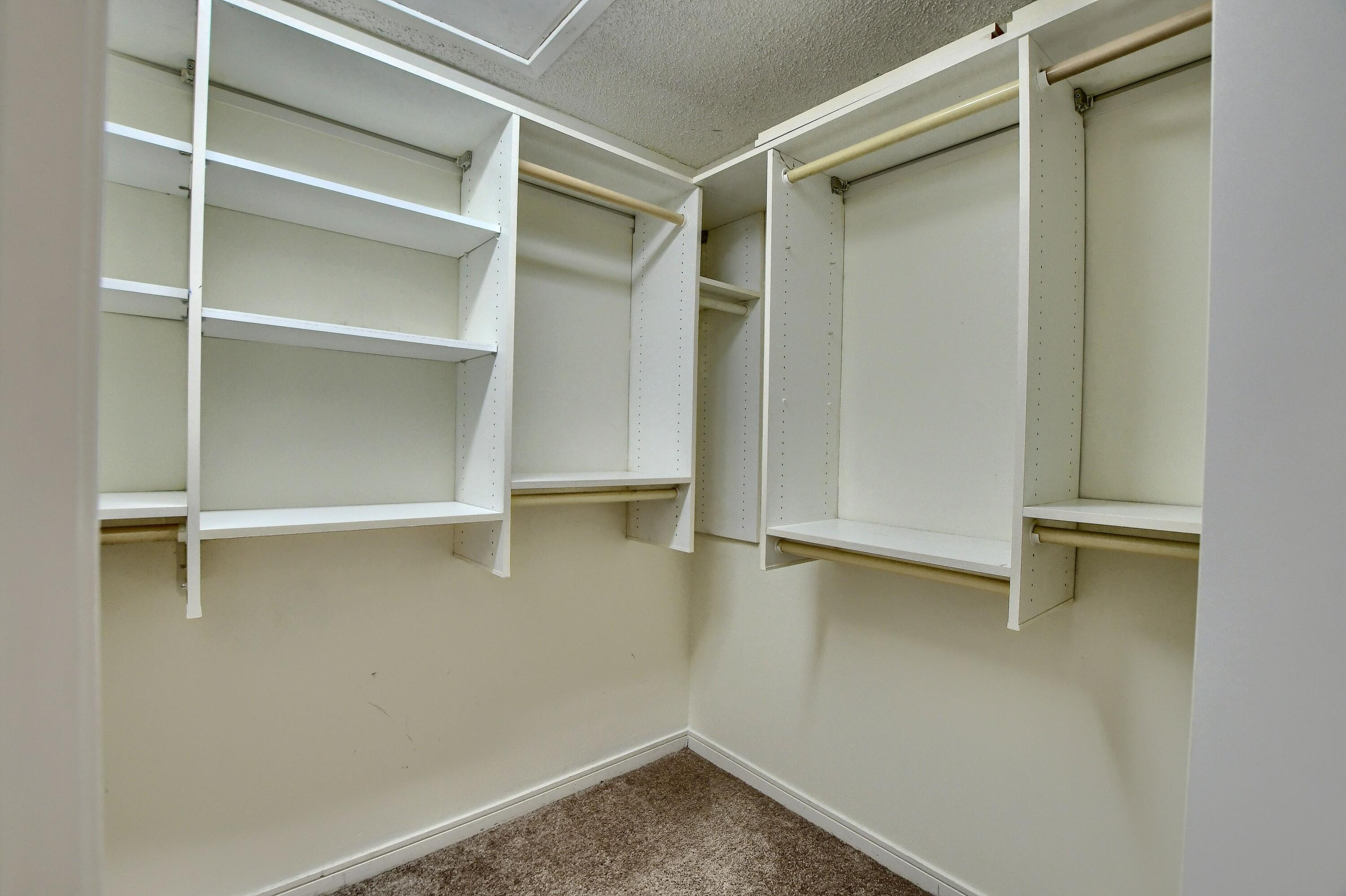 2252 Northwest 53rd Street Boca Raton, FL 33496 - Photo 29 of 41 a view of walk in closet with empty racks