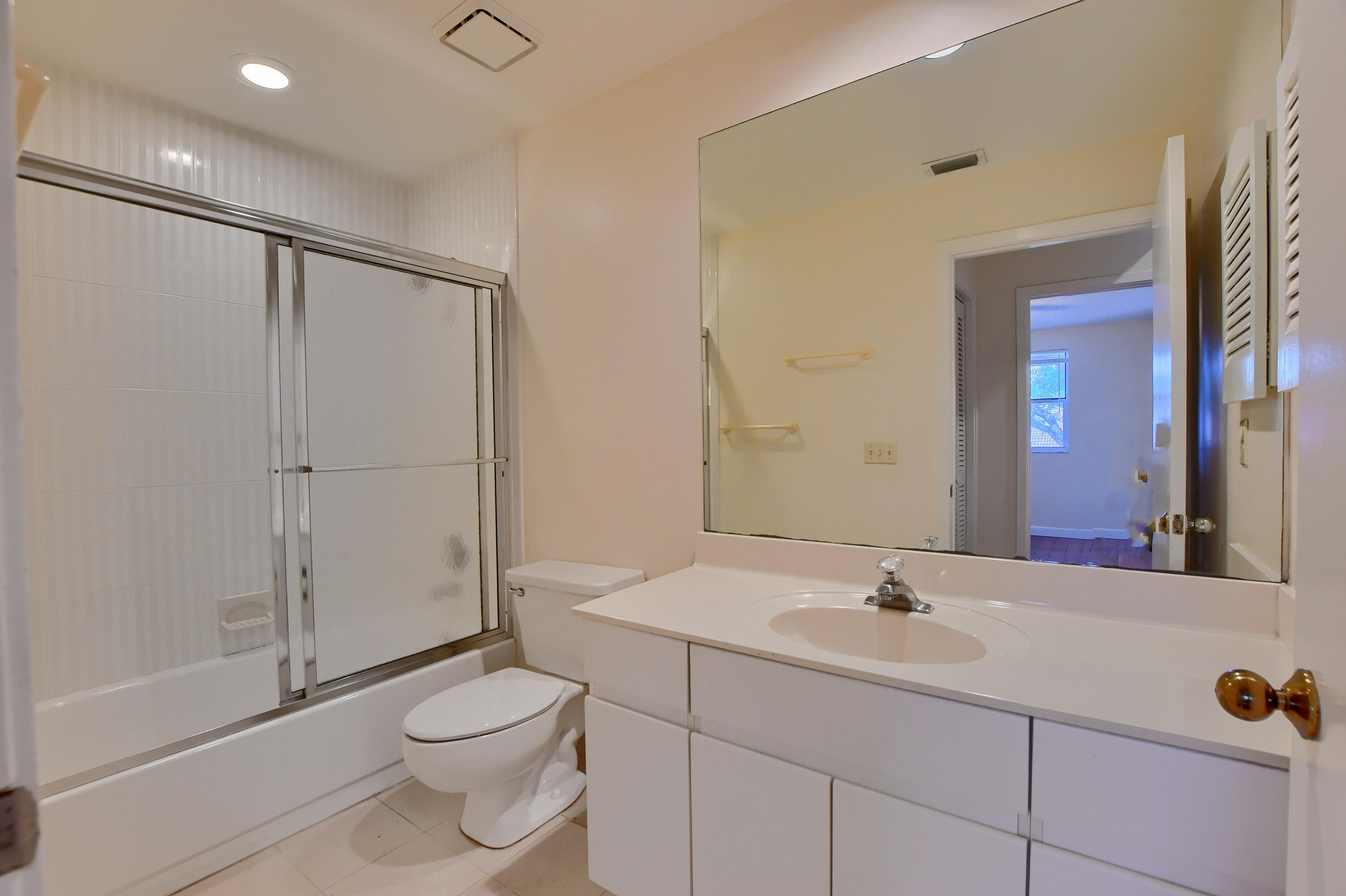 2252 Northwest 53rd Street Boca Raton, FL 33496 - Photo 32 of 41 a bathroom with a sink a toilet and shower