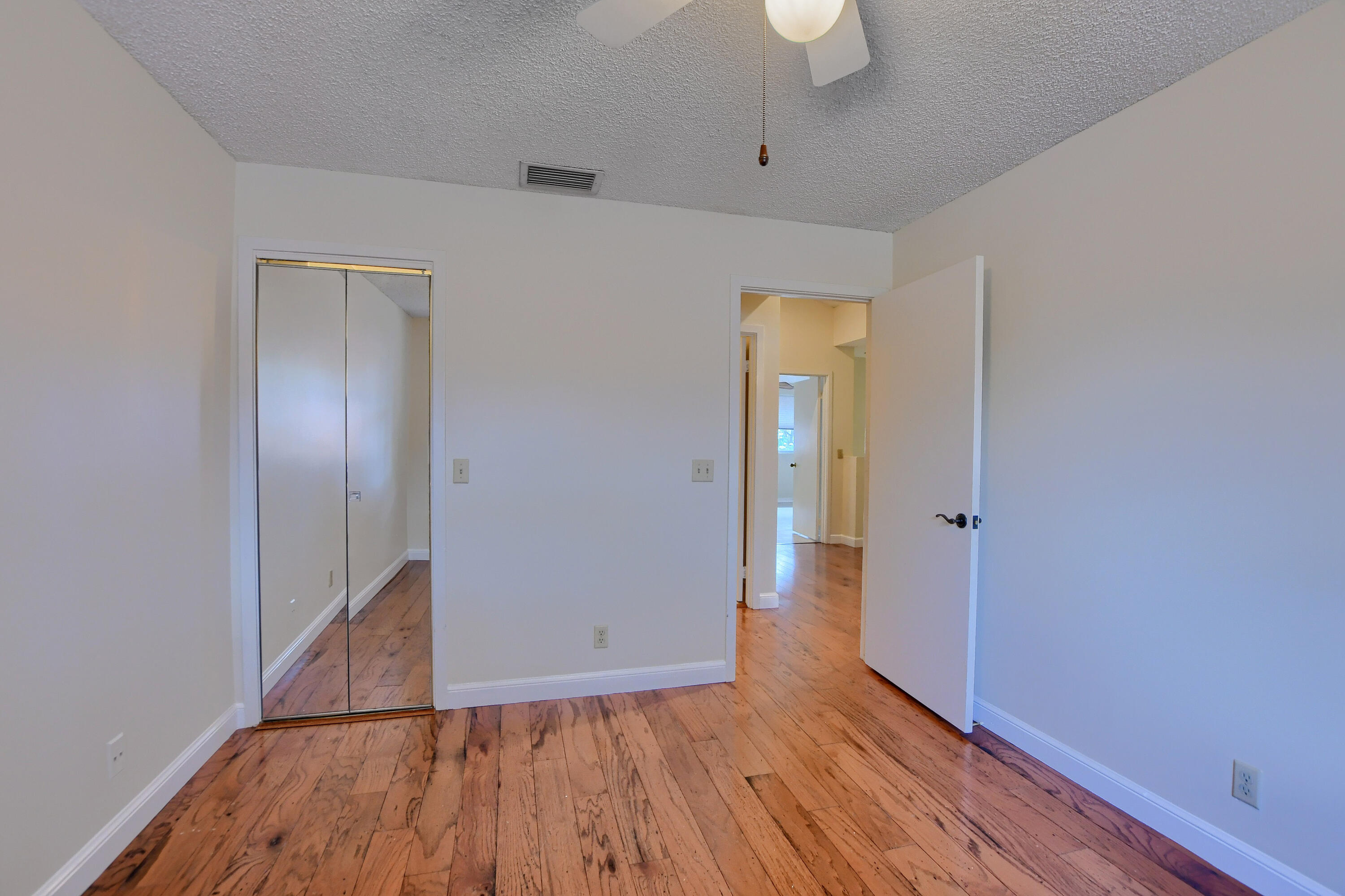 2252 Northwest 53rd Street Boca Raton, FL 33496 - Photo 34 of 41 wooden floor in an empty room with a window