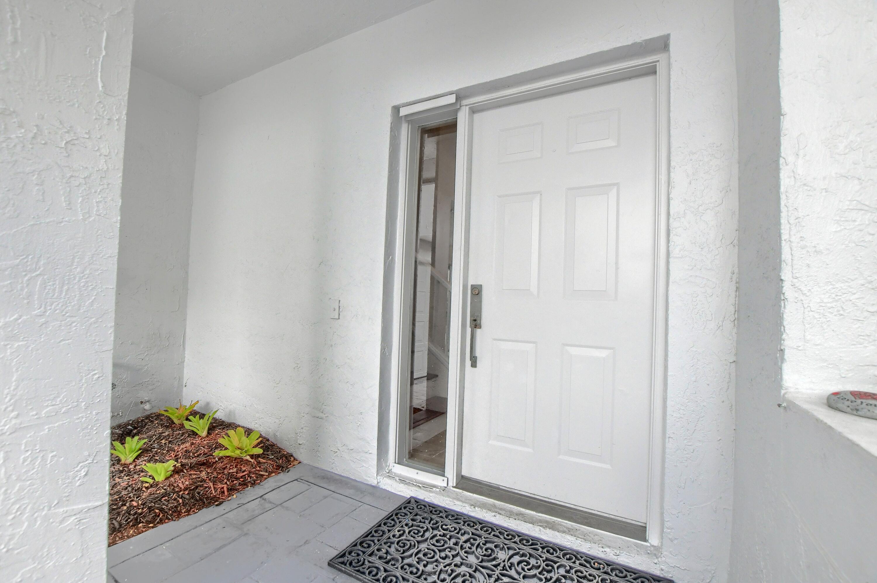 2252 Northwest 53rd Street Boca Raton, FL 33496 - Photo 5 of 41 a view of room with wooden floor and cabinet