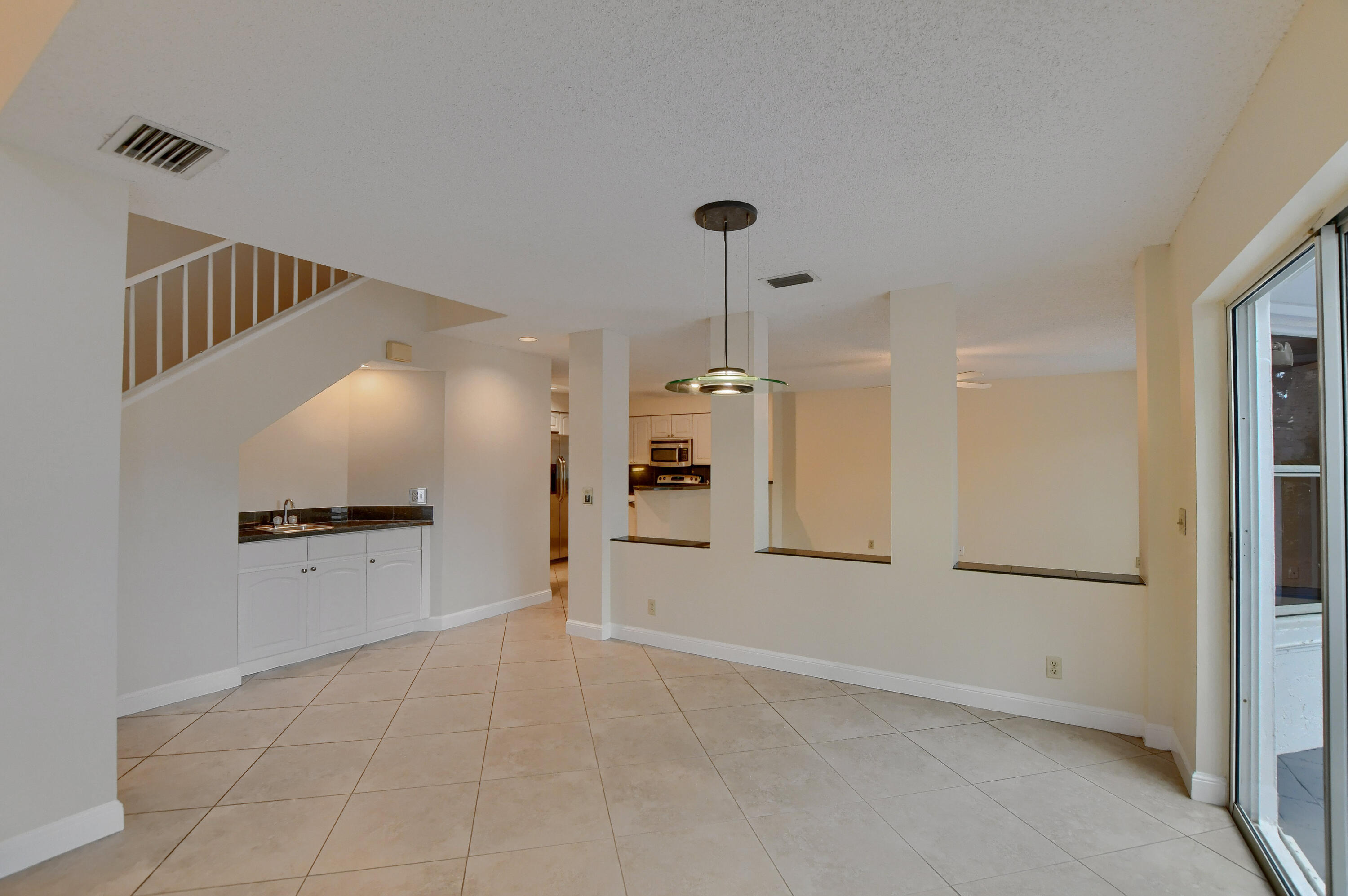 2252 Northwest 53rd Street Boca Raton, FL 33496 - Photo 9 of 41 a view of empty room with wooden floor