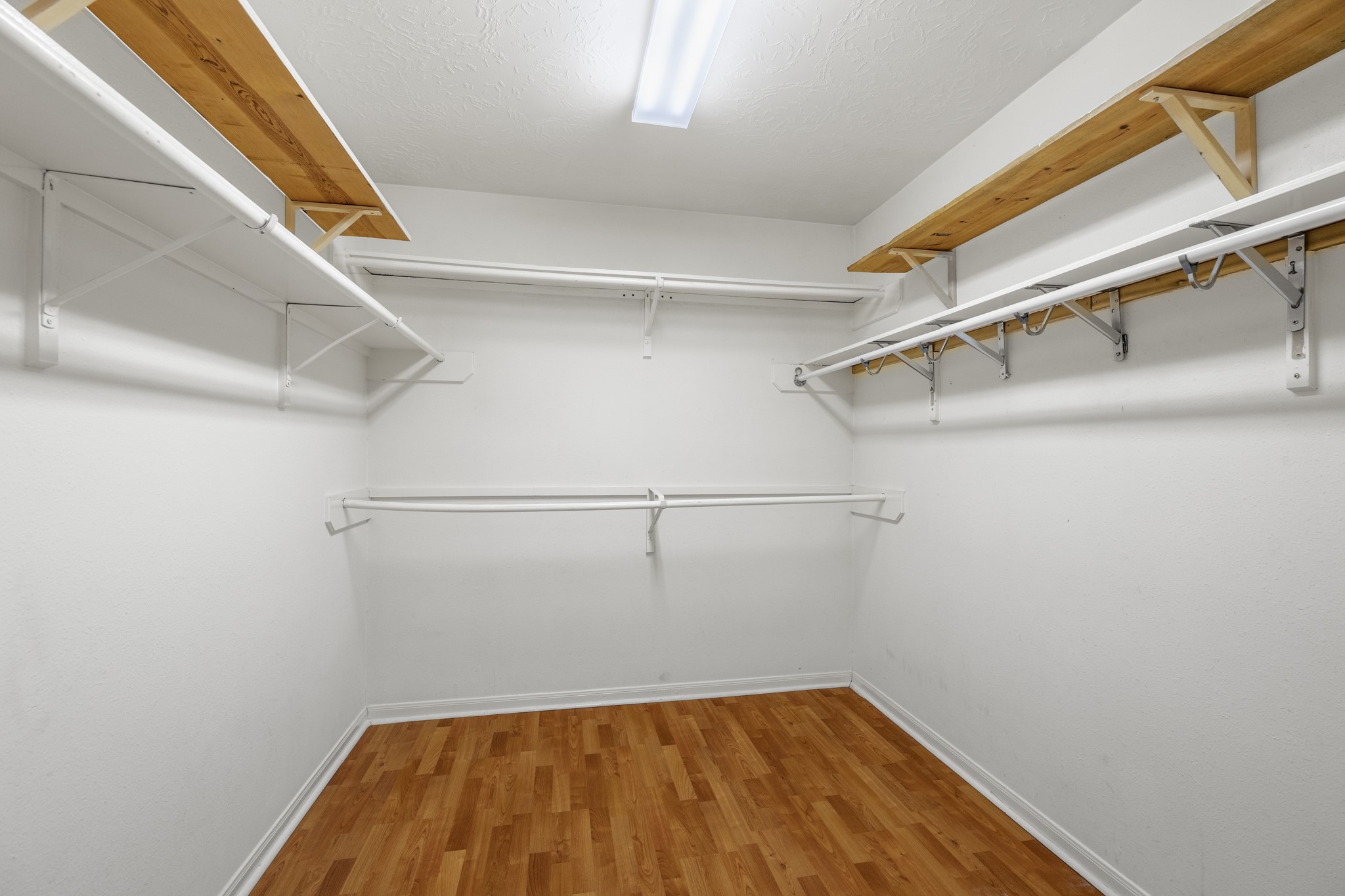 9109 Benwick Street Spring, TX 77379 - Photo 19 of 28 a view of a room with racks on the wall