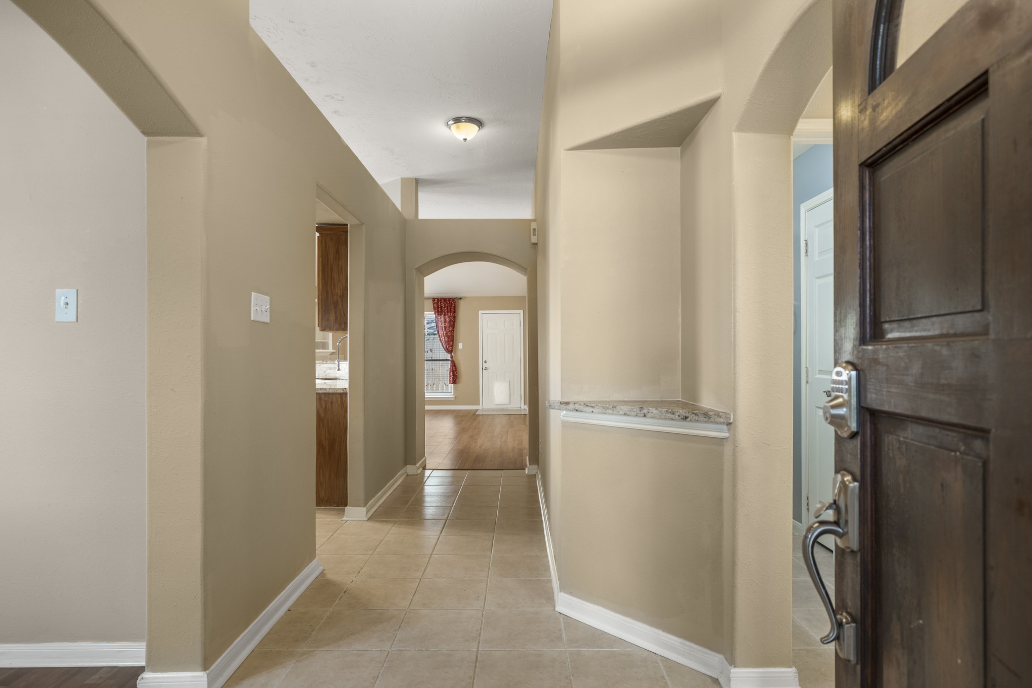 9109 Benwick Street Spring, TX 77379 - Photo 3 of 28 a view of walk in closet with empty racks