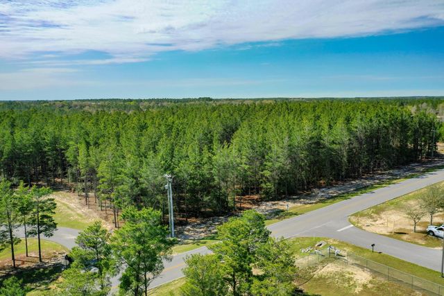 a view of a yard with an outdoor seating