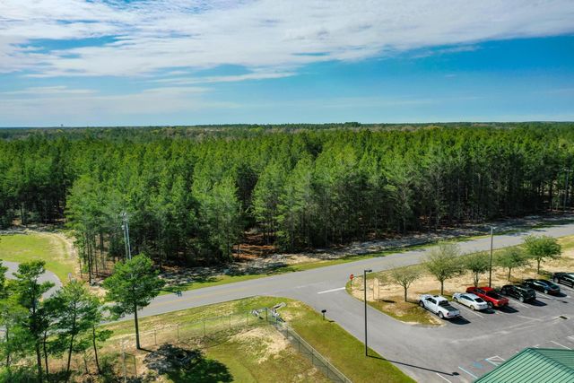a view of a swimming pool and lounge chair