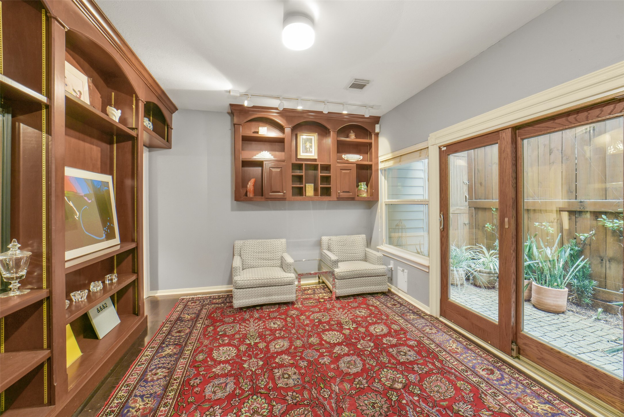 2026 Welch Street Houston, TX 77019 - Photo 24 of 28 lots of built in cabinetry in the first floor bedroom. This could be an alternate primary bedroom