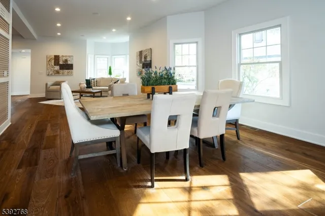 a bedroom with double bed windows and a couch