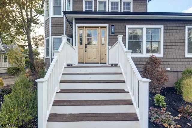 a kitchen with granite countertop a stove and a wooden floors