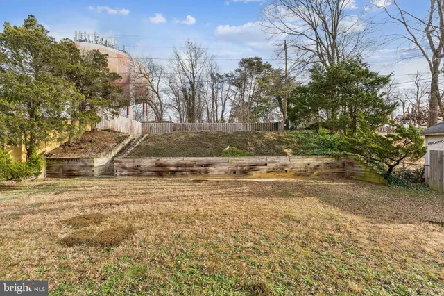 a kitchen with stainless steel appliances a refrigerator and a stove top oven