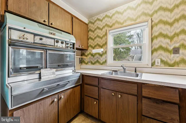 a view of living room with wooden floor and flat screen tv