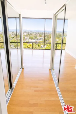 a view of an empty room with a large window