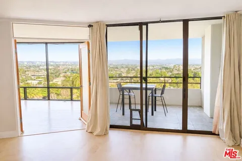a view of a room with a large window