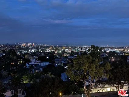 a view of swimming pool with a balcony