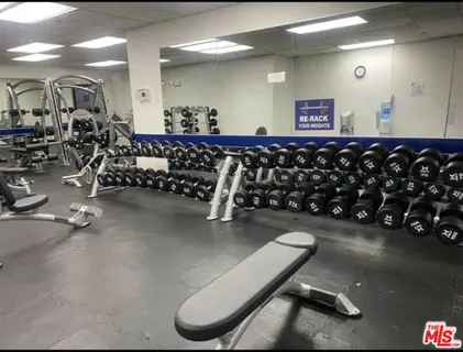 a view of a swimming pool with sitting area