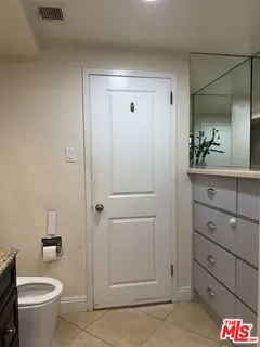 a bathroom with a shower and a toilet