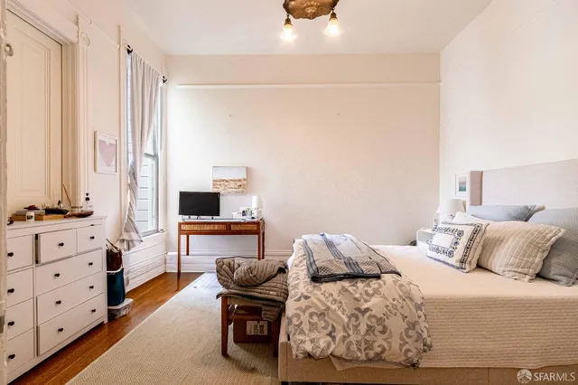 a kitchen with stainless steel appliances a stove refrigerator sink and cabinets